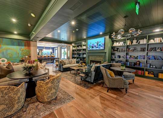 A living room with a greenish hue on the walls and ceiling.