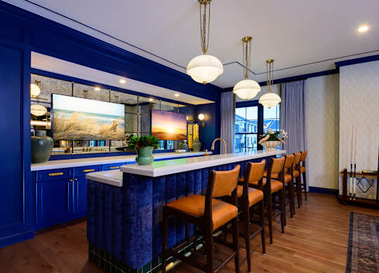 A kitchen with blue cabinets and a white countertop.