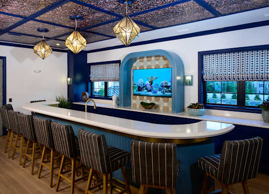 Community clubhouse with seating and aquarium at Fairmont Apartments, Westerville