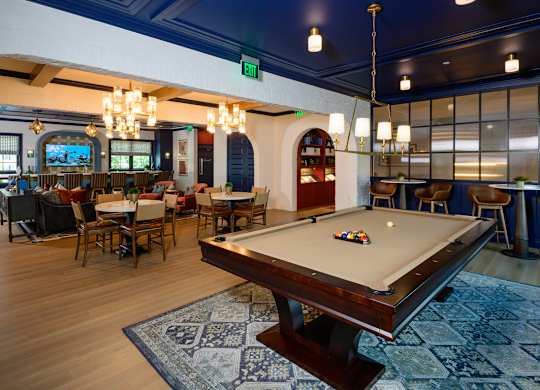 Community clubhouse with billiards and dining area at Fairmont Apartments, Ohio