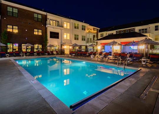 Evening pool area with cabanas and lounge seating at Fairmont Apartments, Westerville