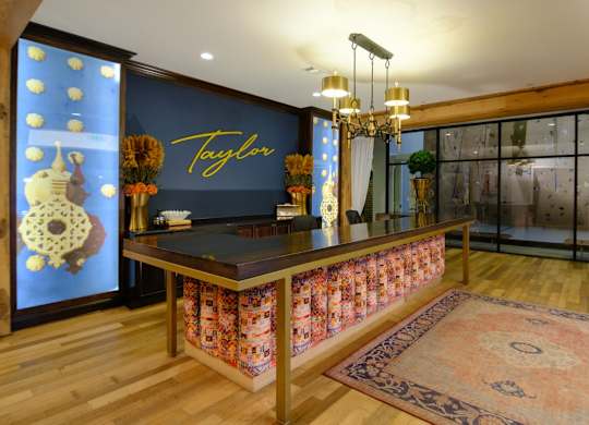 A reception area with a Taylor sign on the wall.