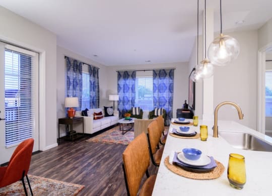a kitchen and living room with a large table and a sink at Essex, Columbus, 43212