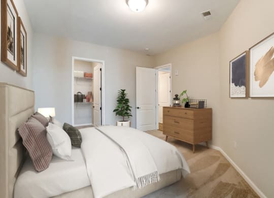 a bedroom with a white bed and a dresser at Essex, Columbus, OH, 43212