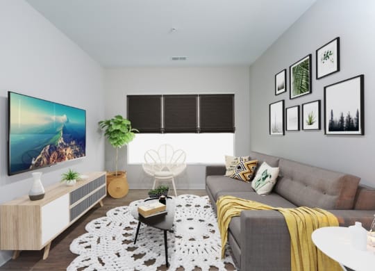 a living room with a gray couch and a yellow blanket at Fairfax, Ohio, 43212