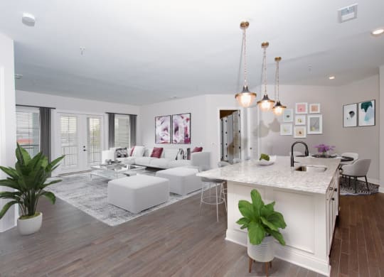 a kitchen and living room with white walls and wood floors at Fairfax, Grandview