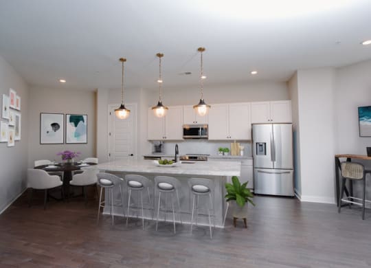 a kitchen with a large center island next to a dining room at Fairfax, Grandview, Ohio