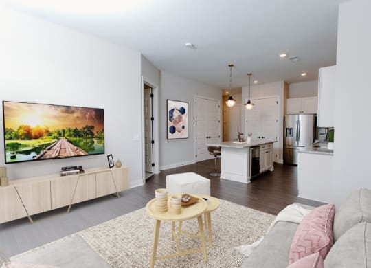 a living room with a couch and a coffee table in front of a tv at Fairfax, Grandview, 43212