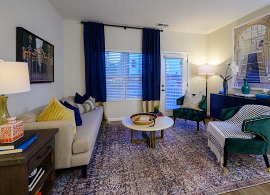 A living room with a couch, chair, and table. at Fairmont Apartments, Ohio