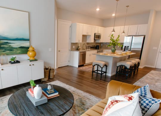 a spacious living room with a kitchen in the background at Kendall Park Too, Columbus, OH