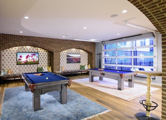 a game room with two pool tables and a flat screen tv at Taylor House, Ohio, 43214