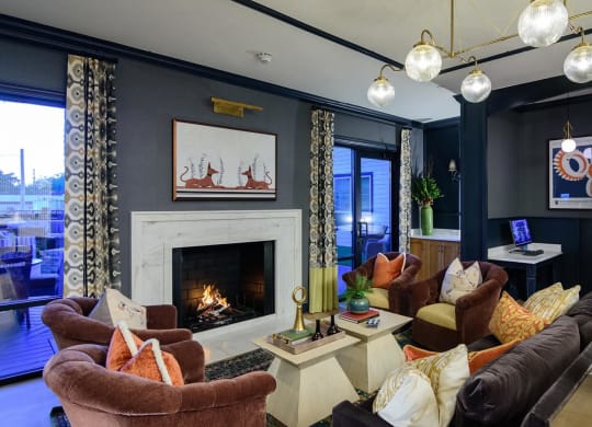 a living room with blue walls and a fireplace at Essex, Columbus, OH, 43212