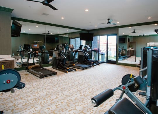 a room filled with lots of different types of exercise equipment at Fairfax, Grandview, Ohio