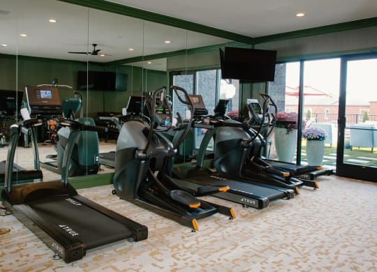 a room filled with lots of different types of exercise equipment at Fairfax, Grandview, OH