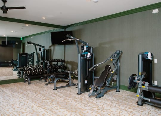 a room filled with lots of different types of exercise equipment at Fairfax, Grandview, 43212