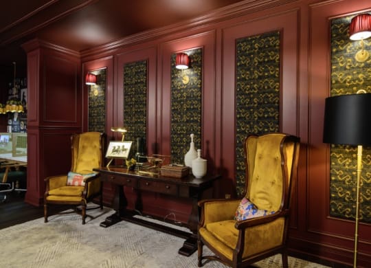 a room with red walls and yellow chairs at Fairfax, Grandview, OH