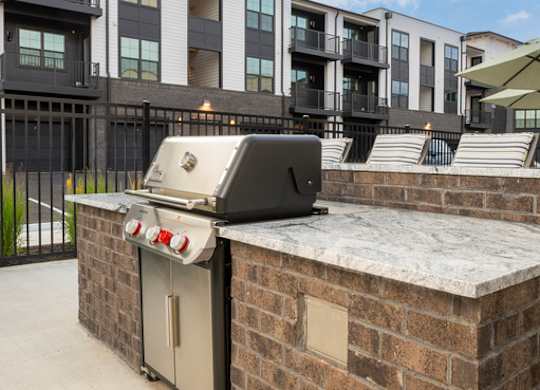 A brick wall with a dishwasher on top of it.