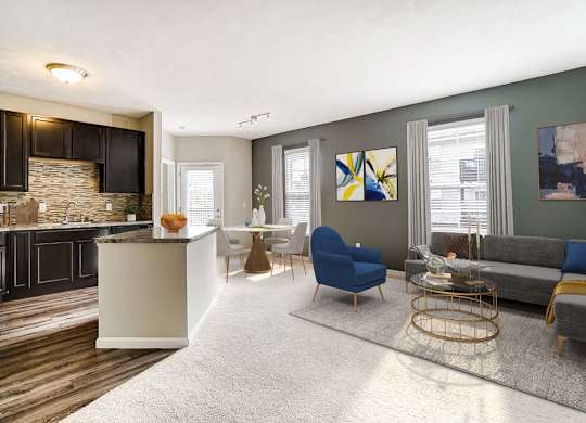 A modern living room with a stone fireplace and a grey sofa.