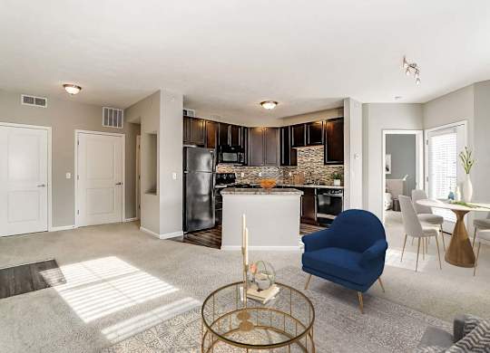 A modern kitchen with a blue chair in the foreground.