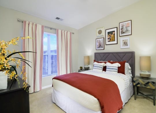 a bedroom with a bed and some pictures on the wall at Taylor House, Columbus, 43214
