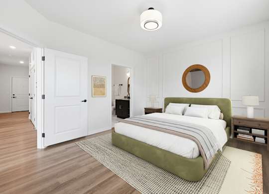 A bedroom with a bed, nightstand, and a mirror on the wall.
