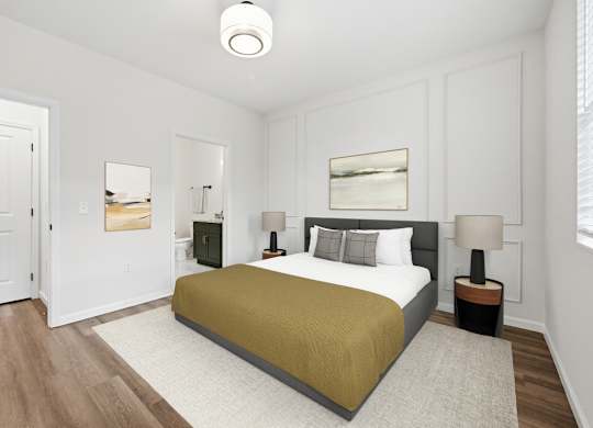 A bedroom with a bed, two lamps, and a painting on the wall.