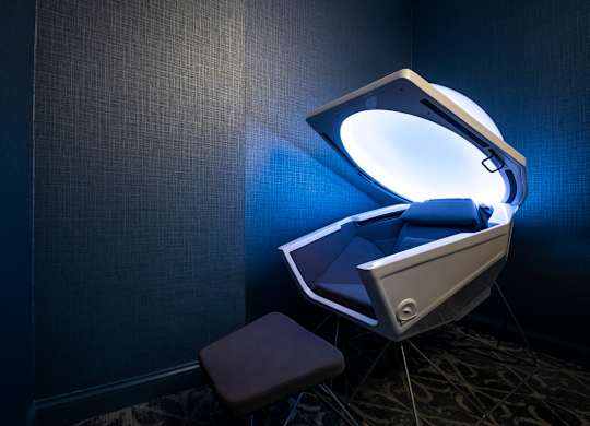 A modern, futuristic style bed with a light on top.