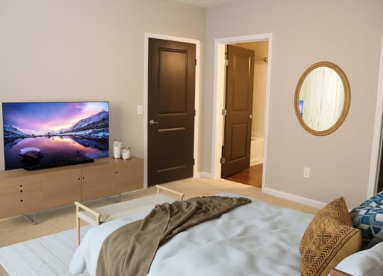 a bedroom with a bed and a tv in it