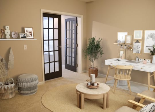 a living room with a desk and a chair