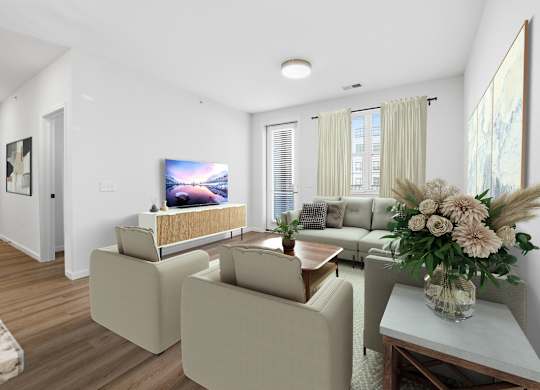 A living room with a couch, a chair, a coffee table, and a television.