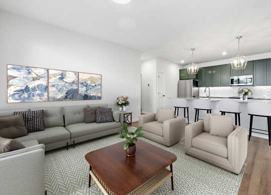 A living room with a large painting on the wall and a kitchen in the background.
