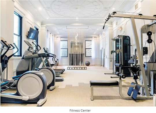 A fitness center with treadmills, elliptical machines, and weightlifting equipment at Grand Wisconsin, Wisconsin