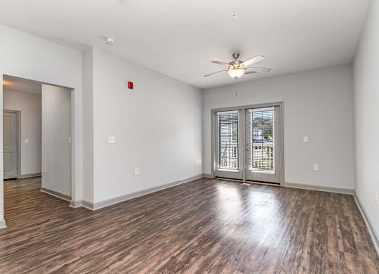 Living room with hardwood floors and a ceiling fan at The Parker Myrtle Beach, Myrtle Beach, SC, 29588