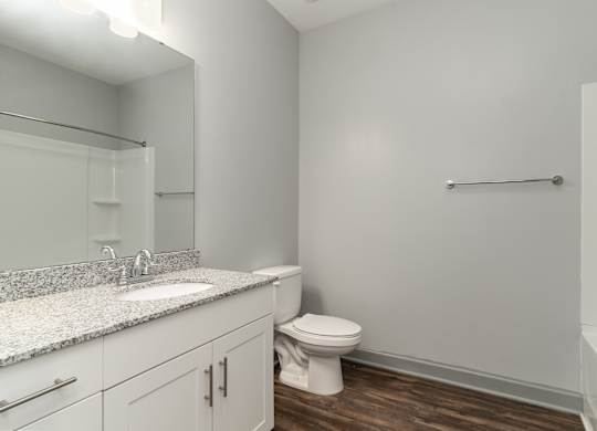 Bathroom with a toilet sink and bathtub at The Parker Myrtle Beach, South Carolina, 29588