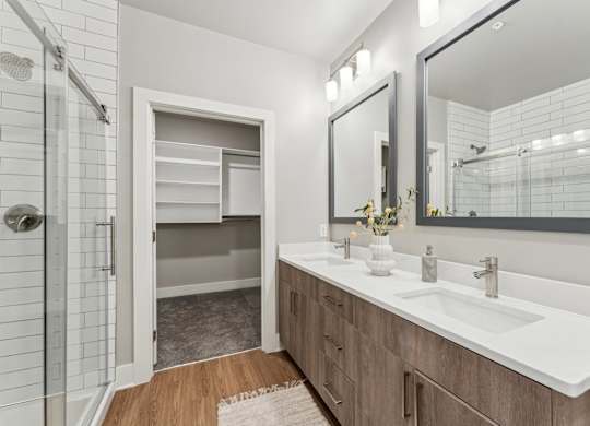 bathroom with view into walk in closet at The Hendry Apartments, Fort Myers, FL