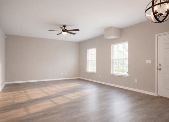 Room with windows and ceiling fan at Club Villas Apartments, Kathleen