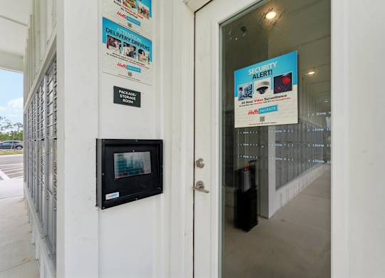 secured entry package room door at The Hendry Apartments, Fort Myers, FL, 33905