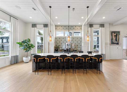 A large conference room with a long table and chairs at The Hendry Apartments, Fort Myers, 33905