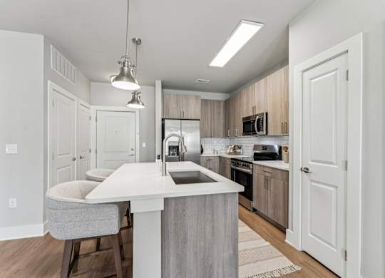 kitchen with island at The Hendry Apartments, Fort Myers, 33905