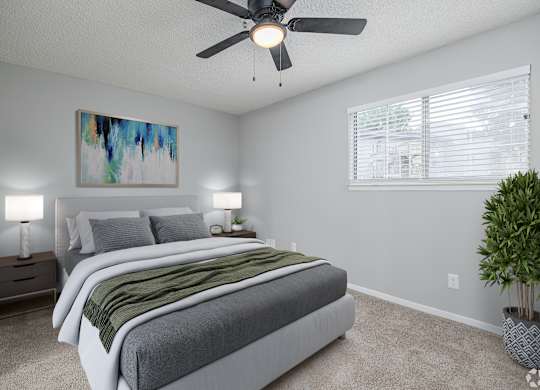 A Bedroom With Painting on the Wall at Avondale Place Apartments, Avondale Estates, GA, 30002