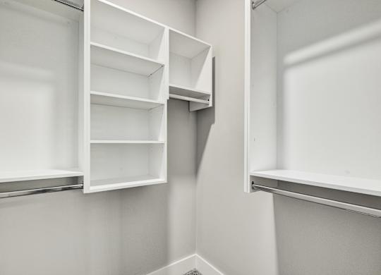 Empty white shelves in a room at The Ashton at East Park Apartments, Kennesaw, 30144