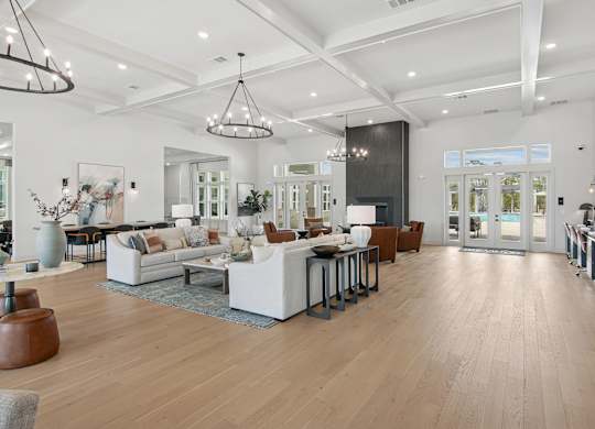 A spacious living room with a variety of furniture and decor at The Hendry Apartments, Fort Myers, FL, 33905