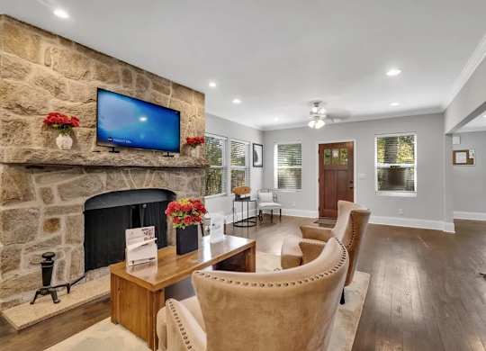 A Living Room With Fireplace at Avondale Place Apartments, Avondale Estates, GA, 30002