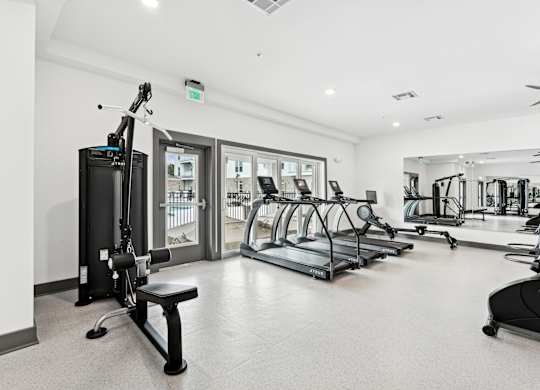 Gym with treadmills and other fitness equipment at the flats at The Leo Myrtle Beach, Myrtle Beach, SC, 29579