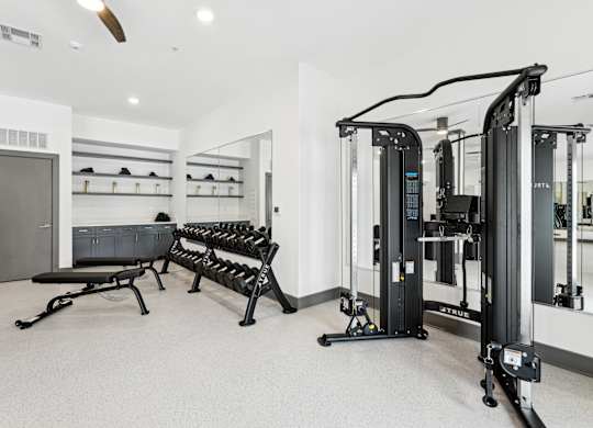 Gym has weights machines and a row of pilates benches at The Leo Myrtle Beach, South Carolina, 29579