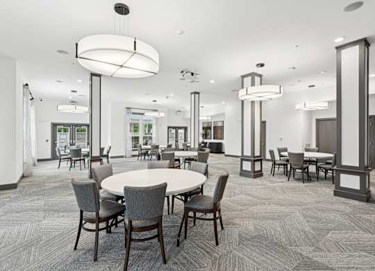 a communal area with tables and chairs in a large room at The Leo Myrtle Beach, South Carolina, 29579