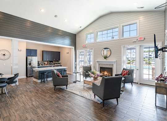 a living room with a fireplace and a table and chairs