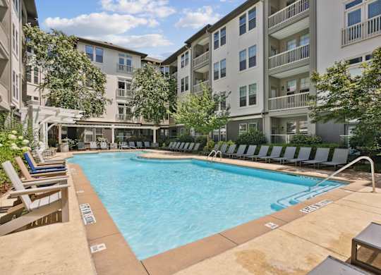 A large swimming pool surrounded by lounge chairs at Union Eleven Apartments, Atlanta, 30324