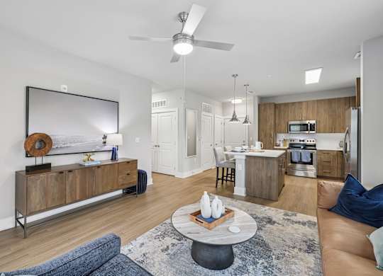 Living Area With Kitchen View at The Exchange at Crestview Apartments, Crestview, Florida