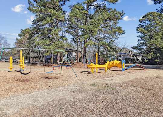 Playground with yellow swing at Lexington on the Green, North Carolina